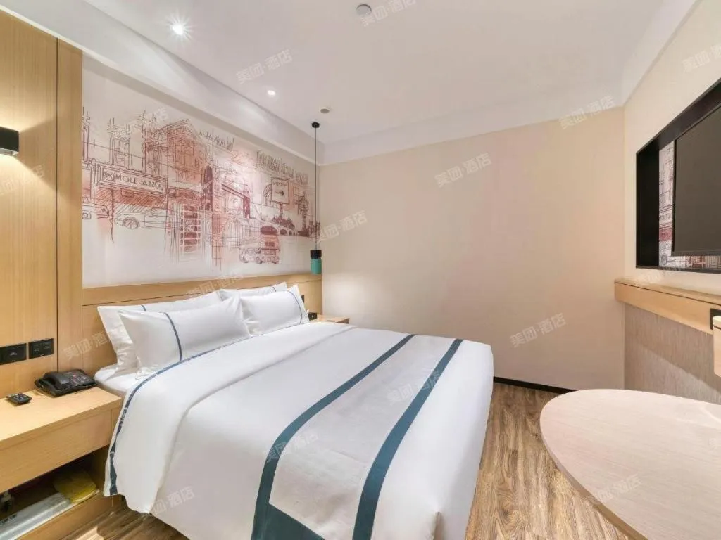 Bed in City Comfort Inn Kunming Flower City Midea Shuncheng Mansion