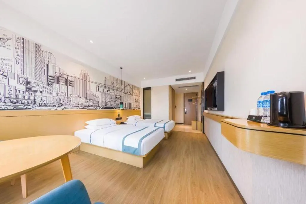 Bed in City Comfort Inn Kunming Flower City Midea Shuncheng Mansion