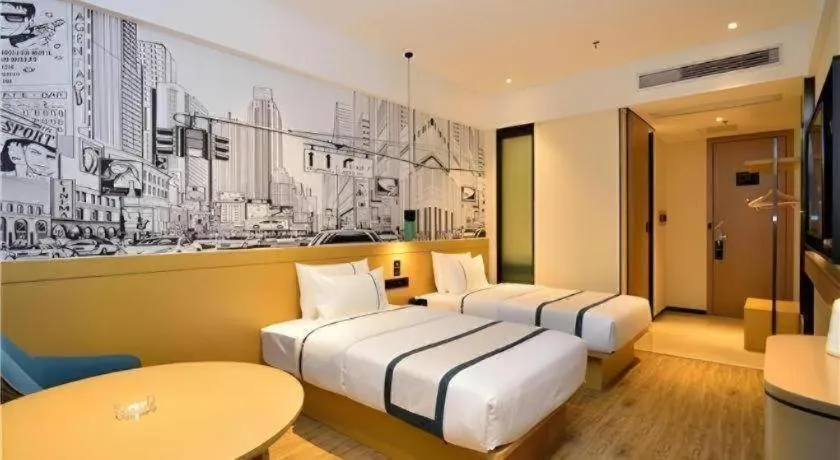 Bed in City Comfort Inn Kunming Flower City Midea Shuncheng Mansion