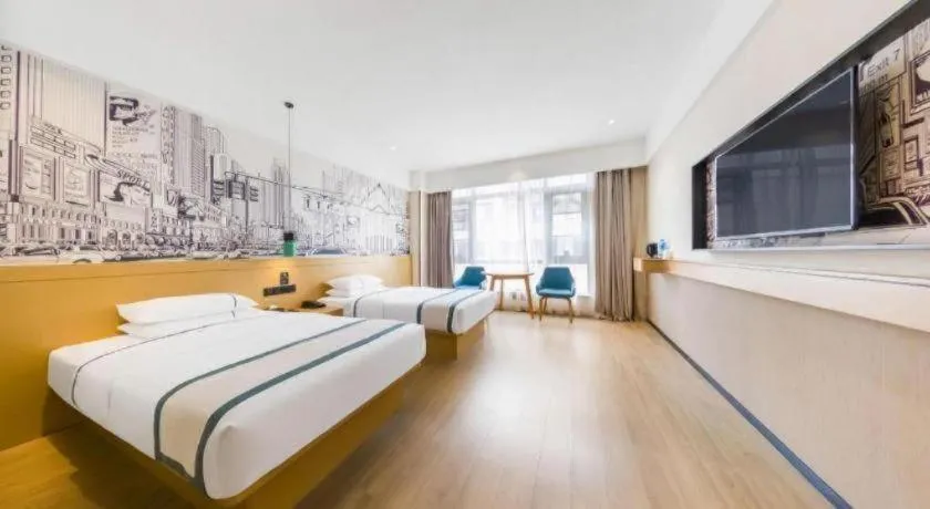 Bed in City Comfort Inn Kunming Flower City Midea Shuncheng Mansion