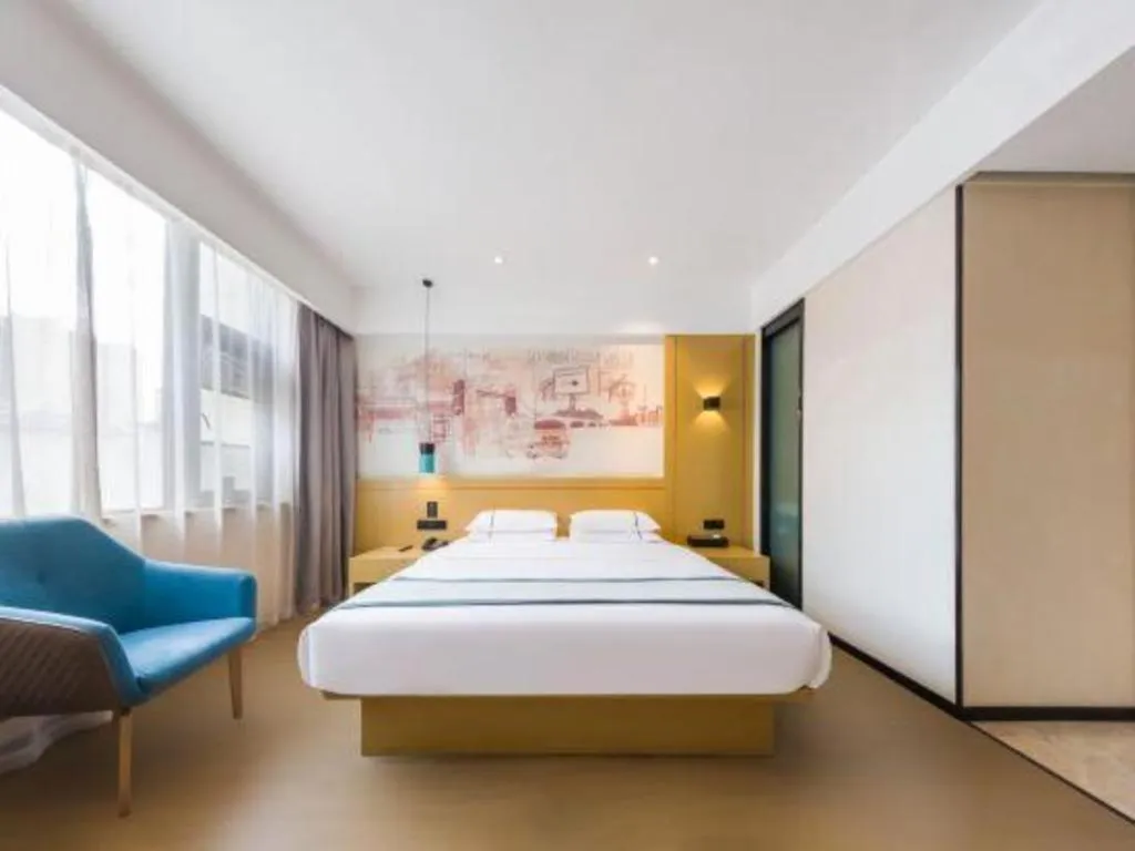 Bed in City Comfort Inn Kunming Flower City Midea Shuncheng Mansion