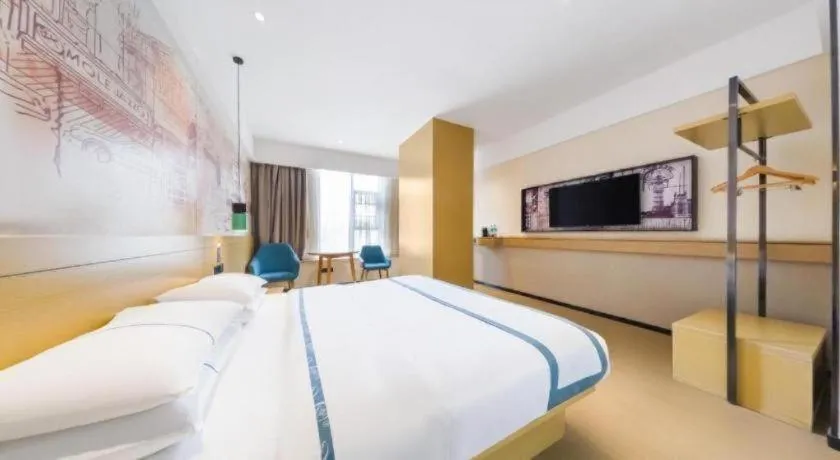 Bed in City Comfort Inn Kunming Flower City Midea Shuncheng Mansion