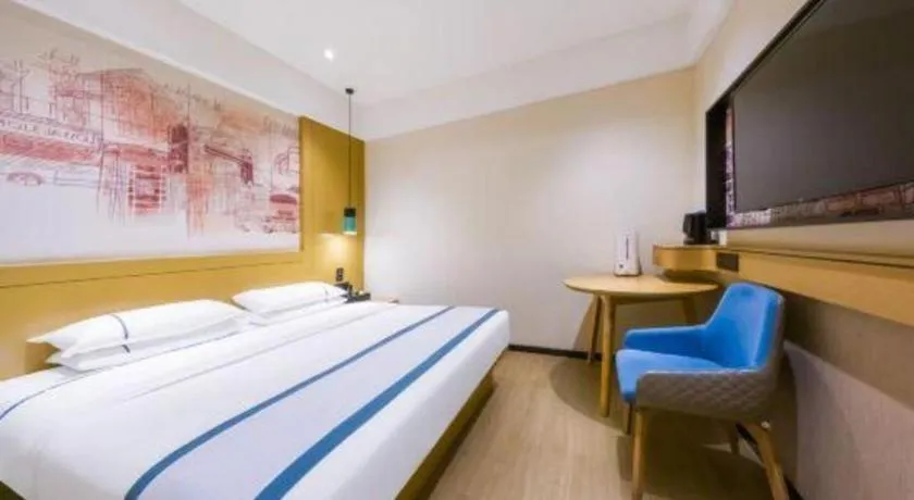 Bed in City Comfort Inn Kunming Flower City Midea Shuncheng Mansion