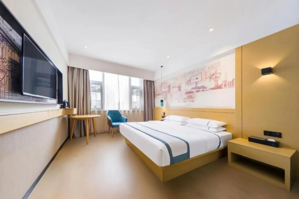 Bed in City Comfort Inn Kunming Flower City Midea Shuncheng Mansion