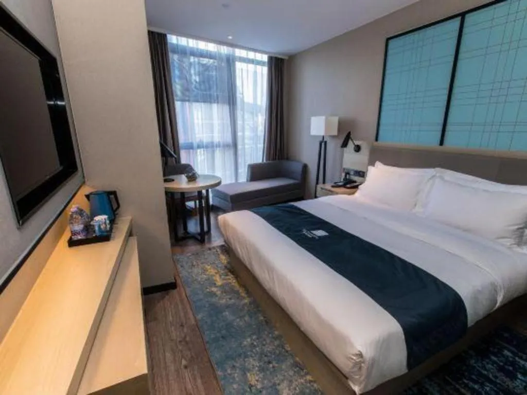 Bed in Echarm Hotel Hefei West Qilitang Metro Station