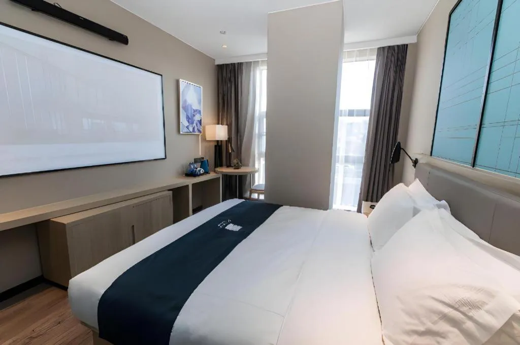 Bed in Echarm Hotel Hefei West Qilitang Metro Station