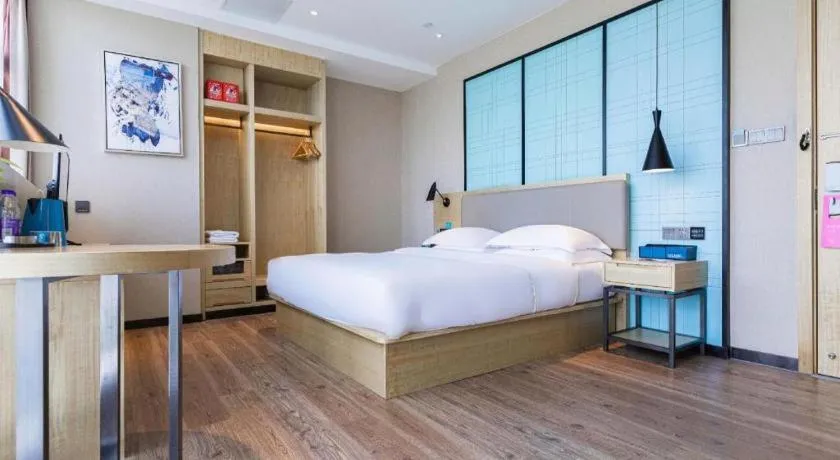 Bed in Echarm Hotel Hefei West Qilitang Metro Station