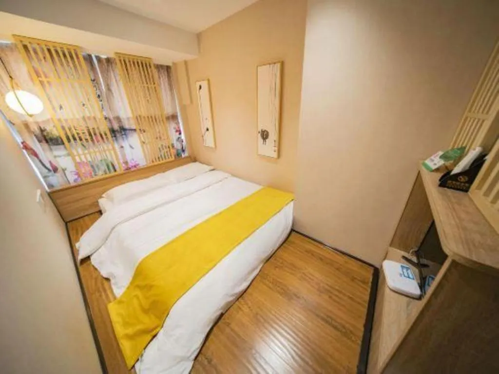 Bed in Echarm Hotel Hefei West Qilitang Metro Station