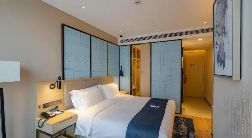 Bed in Echarm Hotel Hefei West Qilitang Metro Station