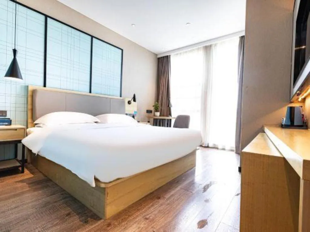 Bed in Echarm Hotel Hefei West Qilitang Metro Station
