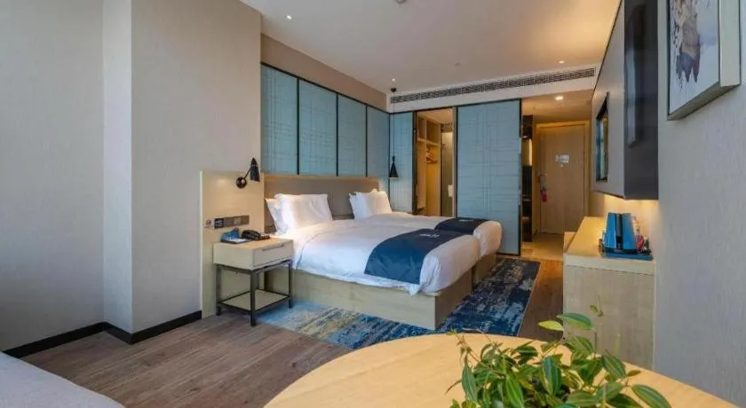 Bed in Echarm Hotel Hefei West Qilitang Metro Station