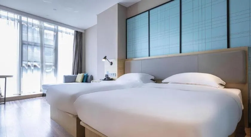 Bed in Echarm Hotel Hefei West Qilitang Metro Station