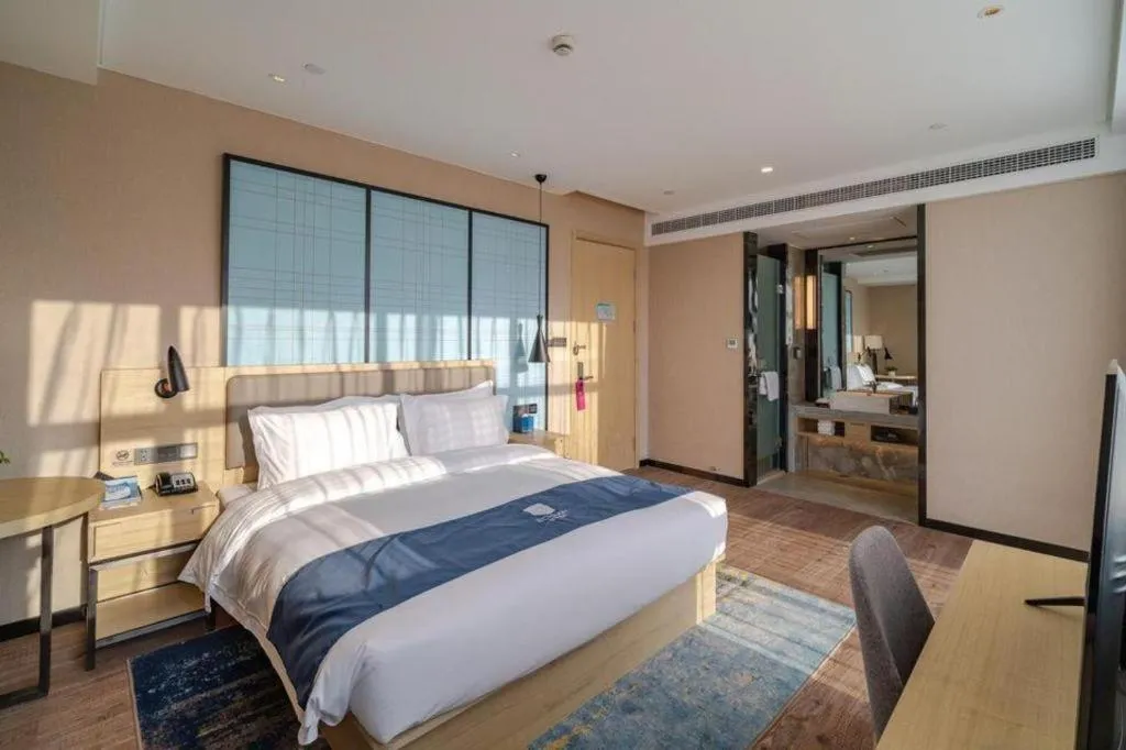 Bed in Echarm Hotel Hefei West Qilitang Metro Station