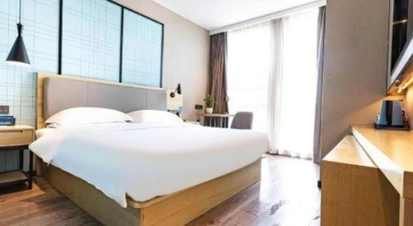 Bed in Echarm Hotel Hefei West Qilitang Metro Station