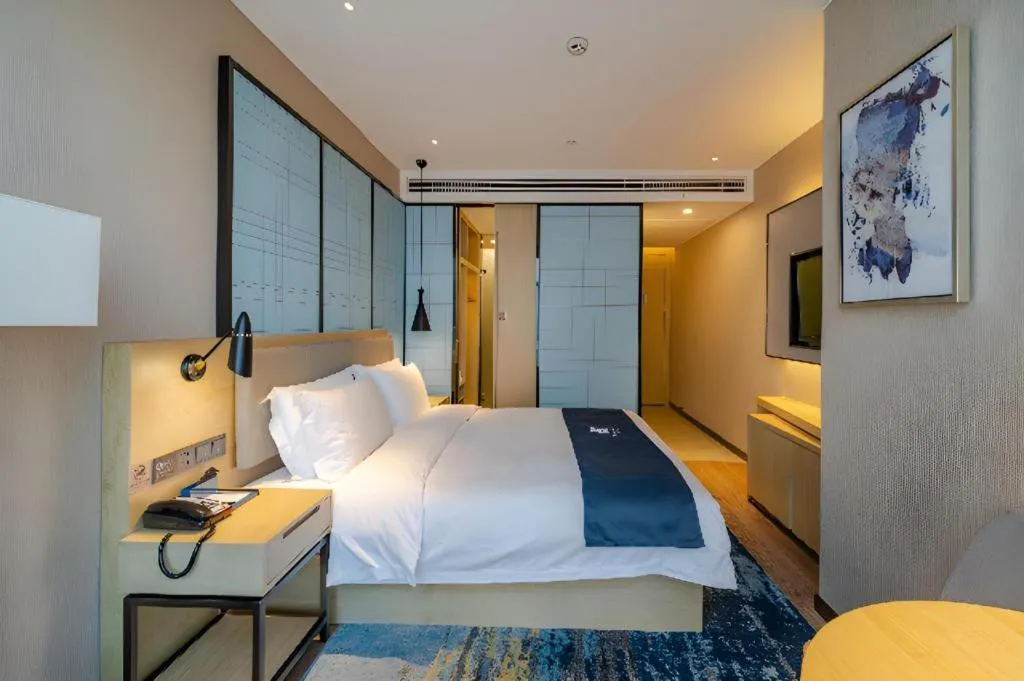 Bed in Echarm Hotel Hefei West Qilitang Metro Station