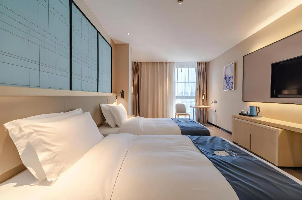 Bed in Echarm Hotel Hefei West Qilitang Metro Station