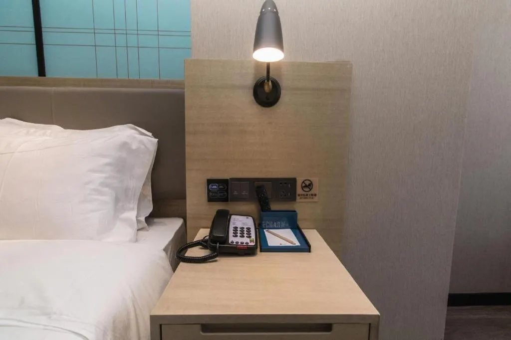 Bed in Echarm Hotel Hefei West Qilitang Metro Station