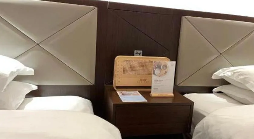 Bed in Borrman Hotel Zhongshan Henglan Xiyong
