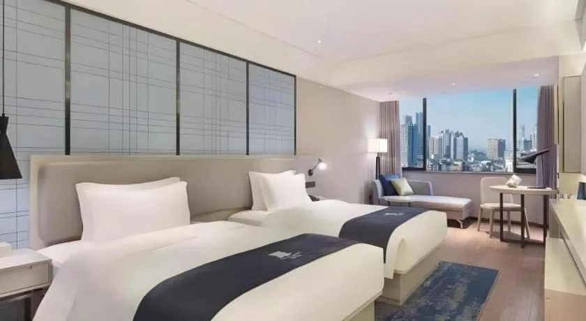 Bed in Echarm Hotel Changsha Xiangya Fushan