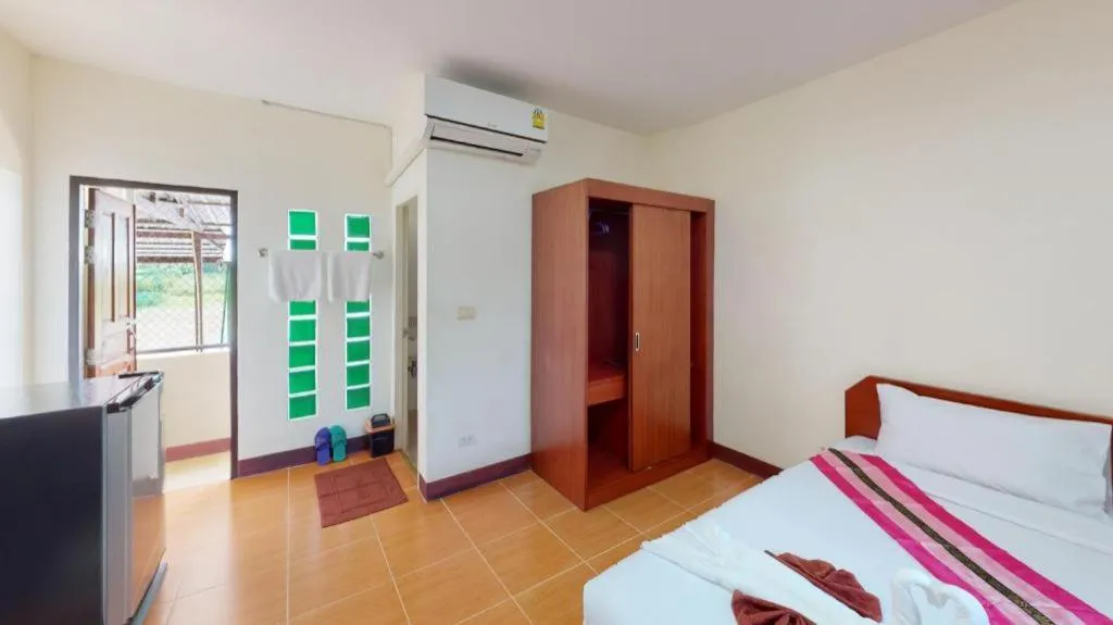 Bed in SC Palace Chiangrai Hotel