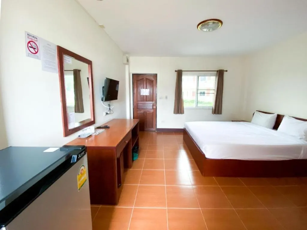 Bed in SC Palace Chiangrai Hotel