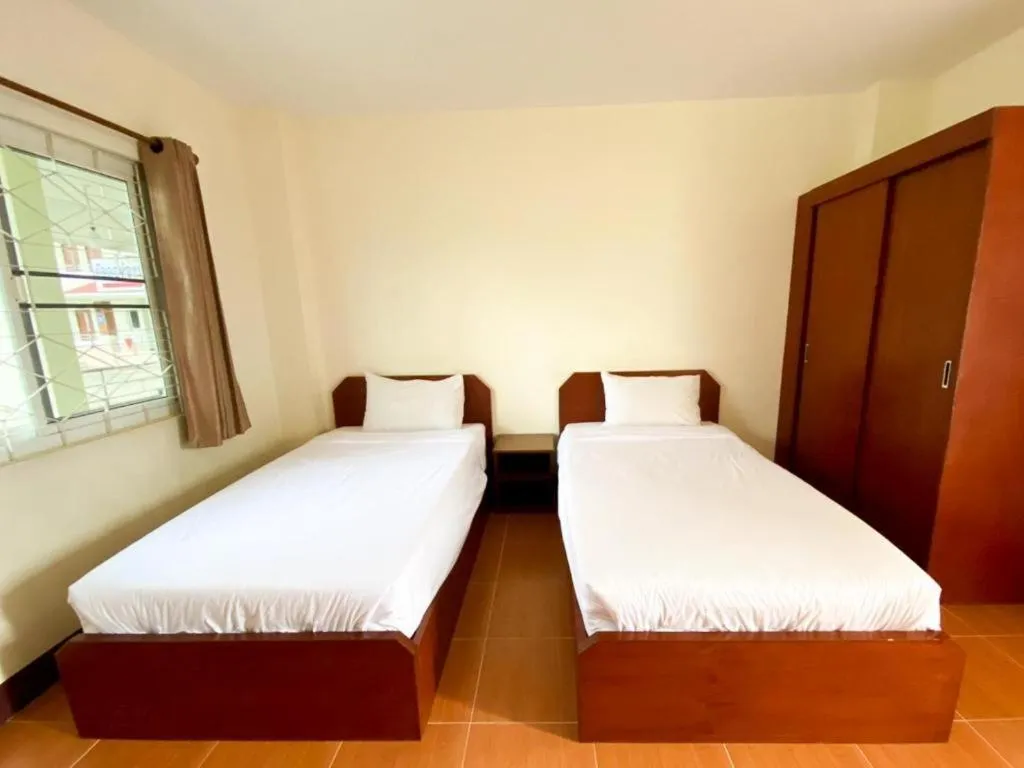 Bed in SC Palace Chiangrai Hotel