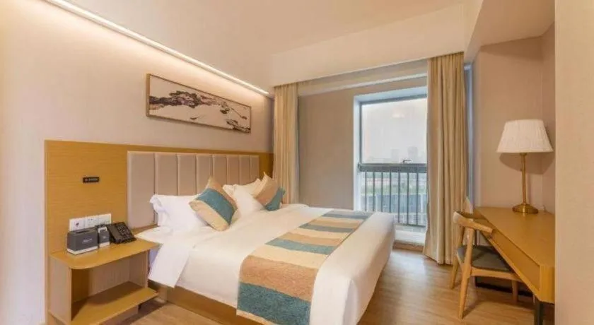 Bed in VX Hotel Wuxi Xinwu District Executive Center Wanda Plaza