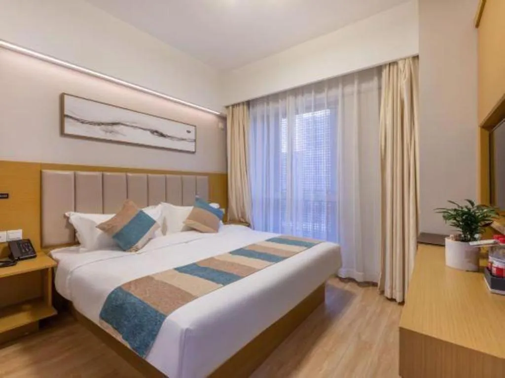 Bed in VX Hotel Wuxi Xinwu District Executive Center Wanda Plaza