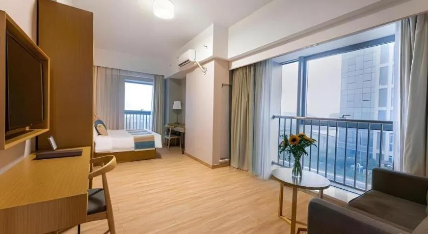 Bed in VX Hotel Wuxi Xinwu District Executive Center Wanda Plaza