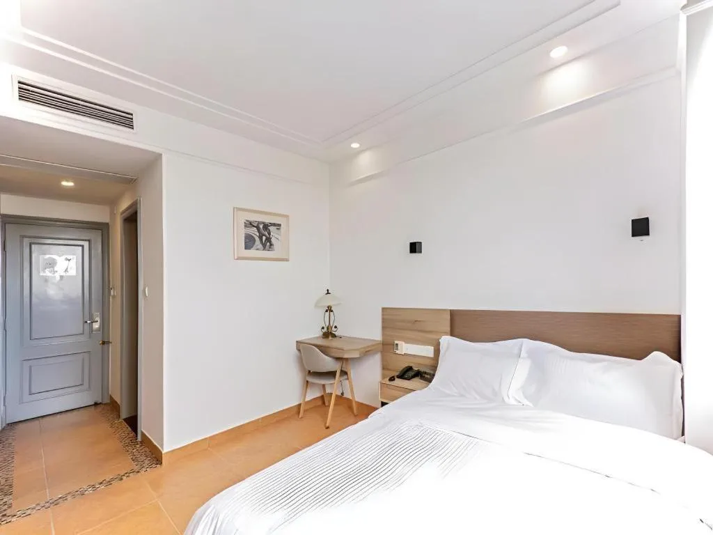 Bed in GreenTree Alliance Hotel Shanghai Baoshan District Meilan Lake Yueluo Road