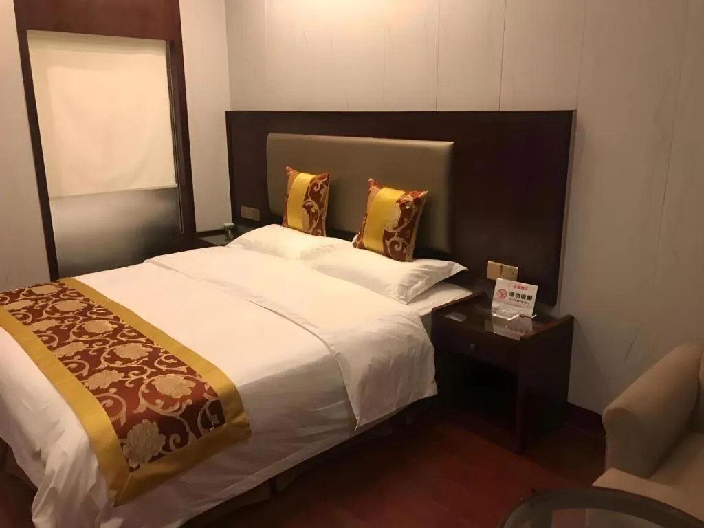 Bed in Shell Hotel Wuxi Jiangyin Zhutang Town