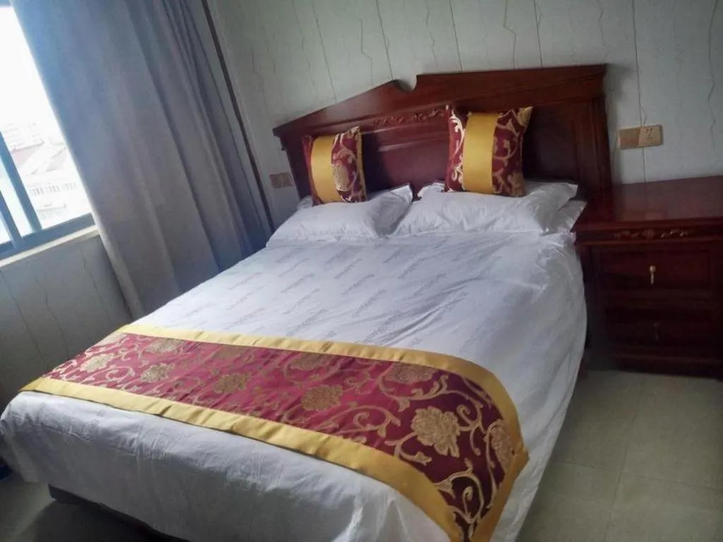 Bed in Shell Hotel Wuxi Jiangyin Zhutang Town