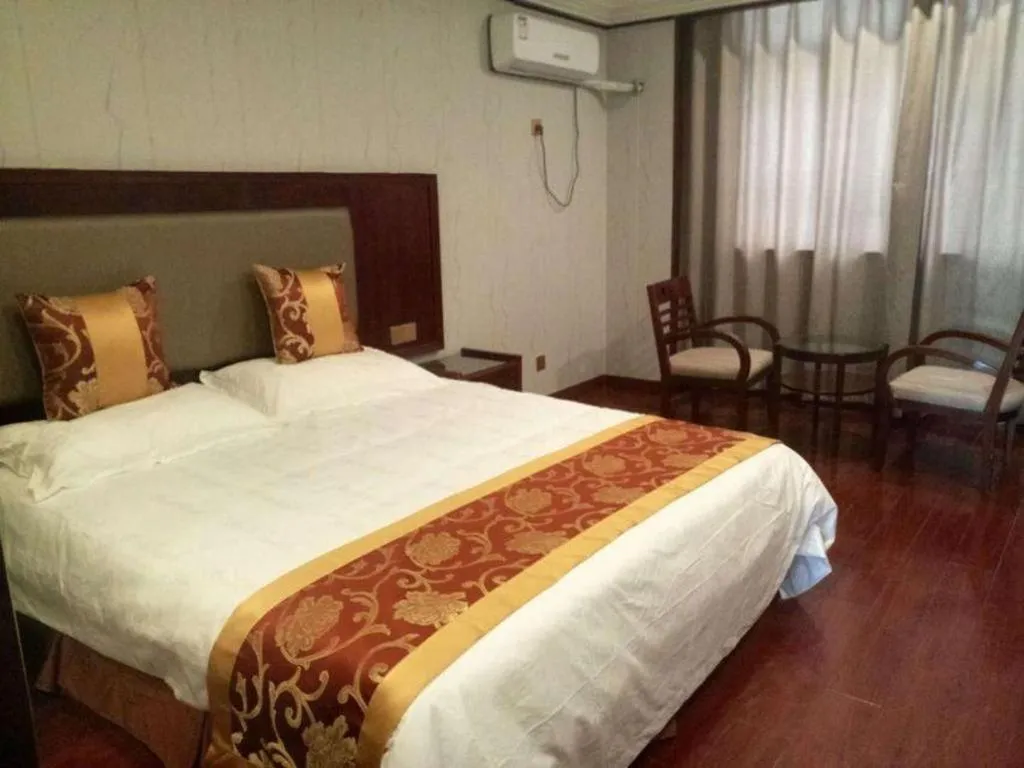 Bed in Shell Hotel Wuxi Jiangyin Zhutang Town