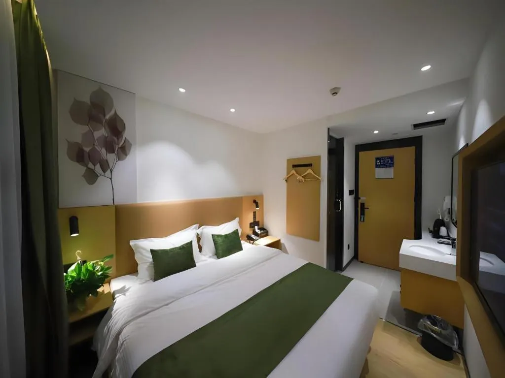 Bed in Green Tree Inn Guangxi Wuzhou 2nd Xinxing Road Liangguang Market