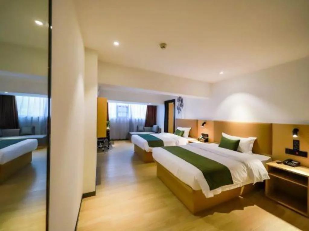 Bed in Green Tree Inn Guangxi Wuzhou 2nd Xinxing Road Liangguang Market