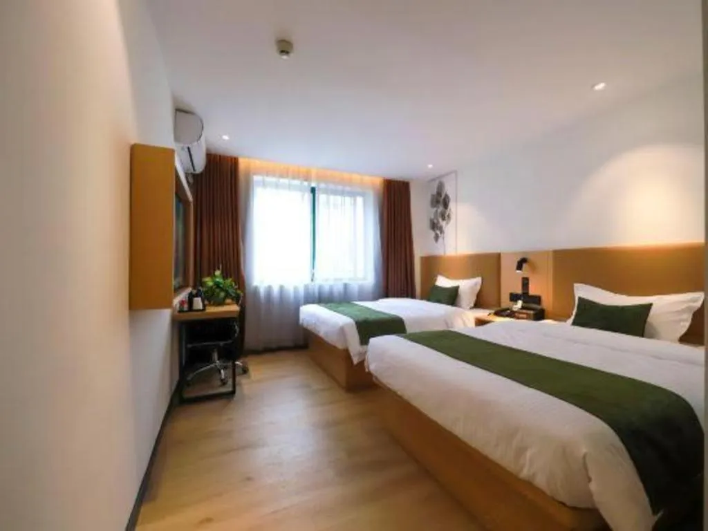 Bed in Green Tree Inn Guangxi Wuzhou 2nd Xinxing Road Liangguang Market