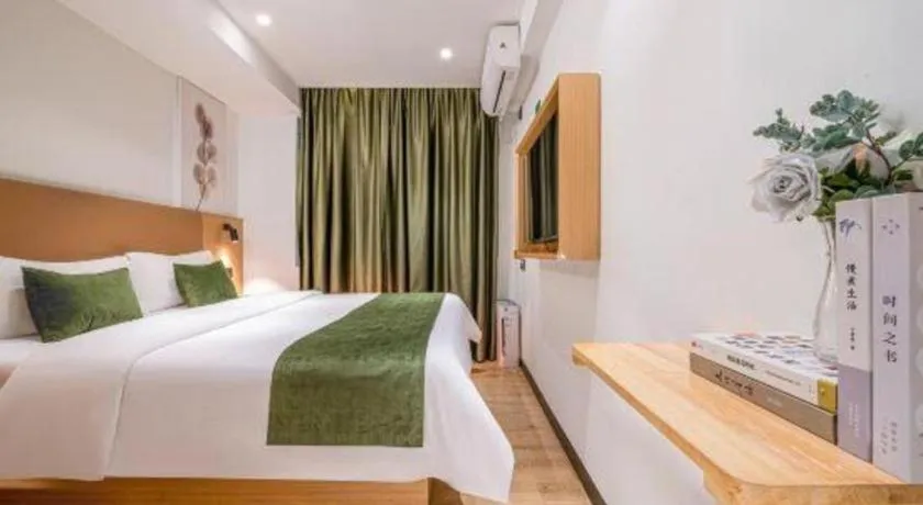 Bed in Green Tree Inn Guangxi Wuzhou 2nd Xinxing Road Liangguang Market