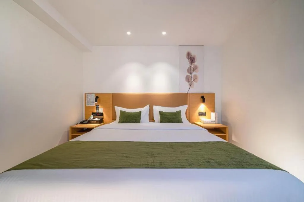 Bed in Green Tree Inn Guangxi Wuzhou 2nd Xinxing Road Liangguang Market