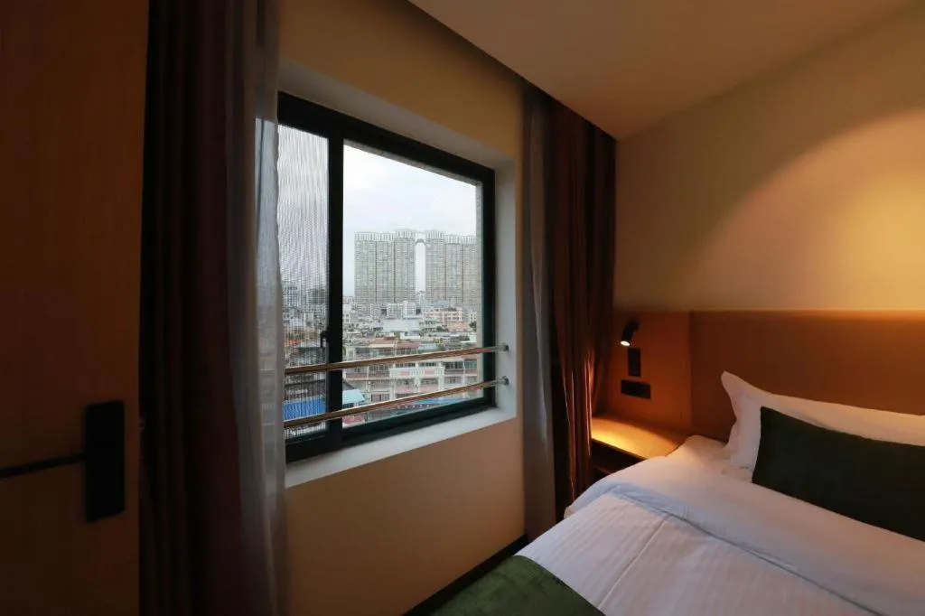 Bed in Green Tree Inn Guangxi Wuzhou 2nd Xinxing Road Liangguang Market