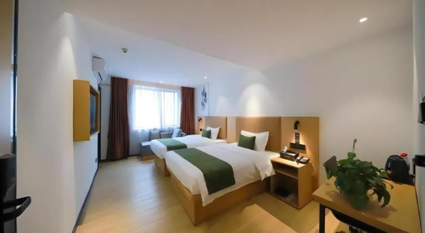 Bed in Green Tree Inn Guangxi Wuzhou 2nd Xinxing Road Liangguang Market
