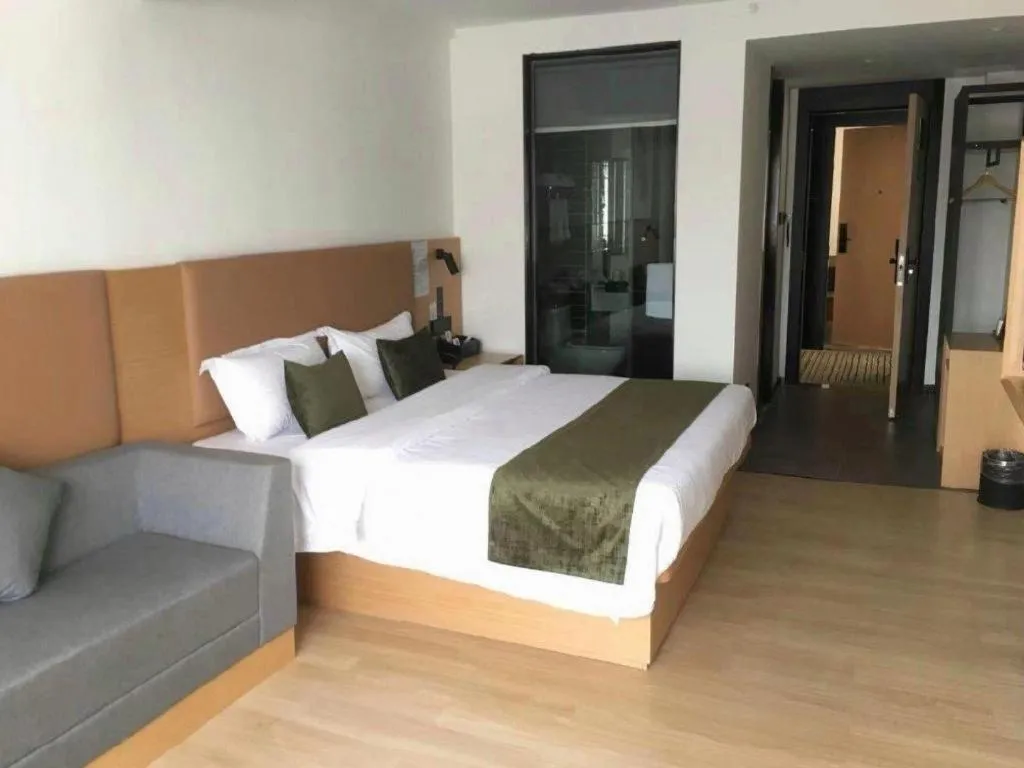 Bed in Green Tree Inn Guangxi Wuzhou 2nd Xinxing Road Liangguang Market