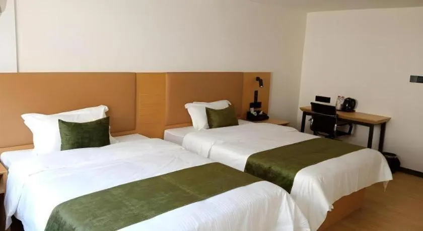 Bed in Green Tree Inn Guangxi Wuzhou 2nd Xinxing Road Liangguang Market