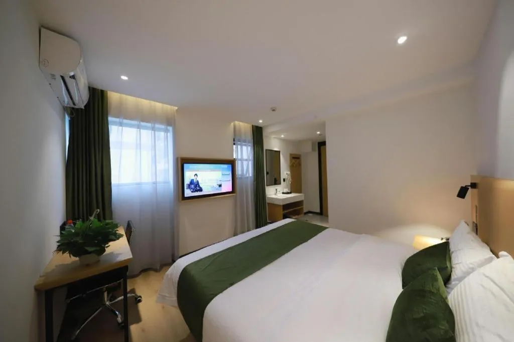 Bed in Green Tree Inn Guangxi Wuzhou 2nd Xinxing Road Liangguang Market