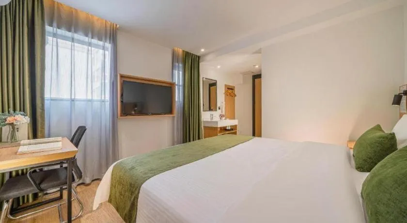 Bed in Green Tree Inn Guangxi Wuzhou 2nd Xinxing Road Liangguang Market
