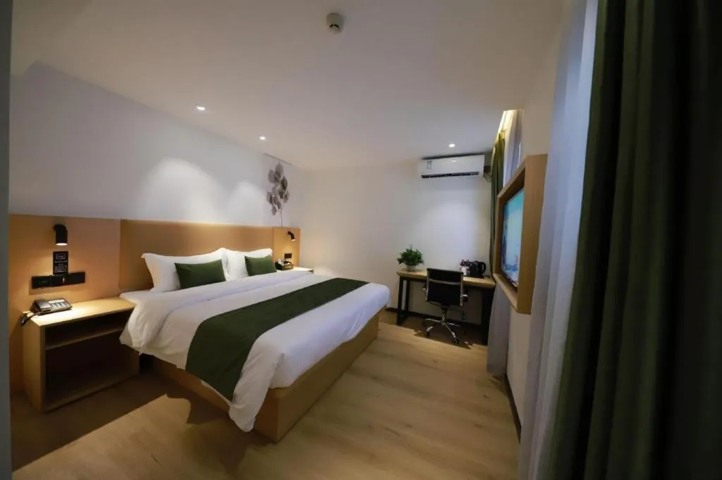 Bed in Green Tree Inn Guangxi Wuzhou 2nd Xinxing Road Liangguang Market