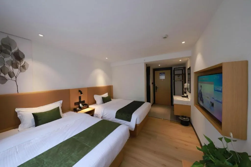 Bed in Green Tree Inn Guangxi Wuzhou 2nd Xinxing Road Liangguang Market