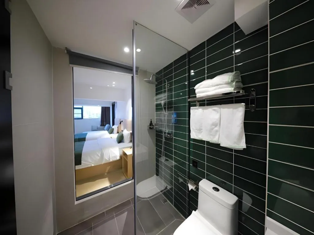 Bed in Green Tree Inn Guangxi Wuzhou 2nd Xinxing Road Liangguang Market