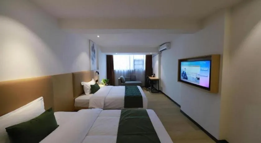 Bed in Green Tree Inn Guangxi Wuzhou 2nd Xinxing Road Liangguang Market