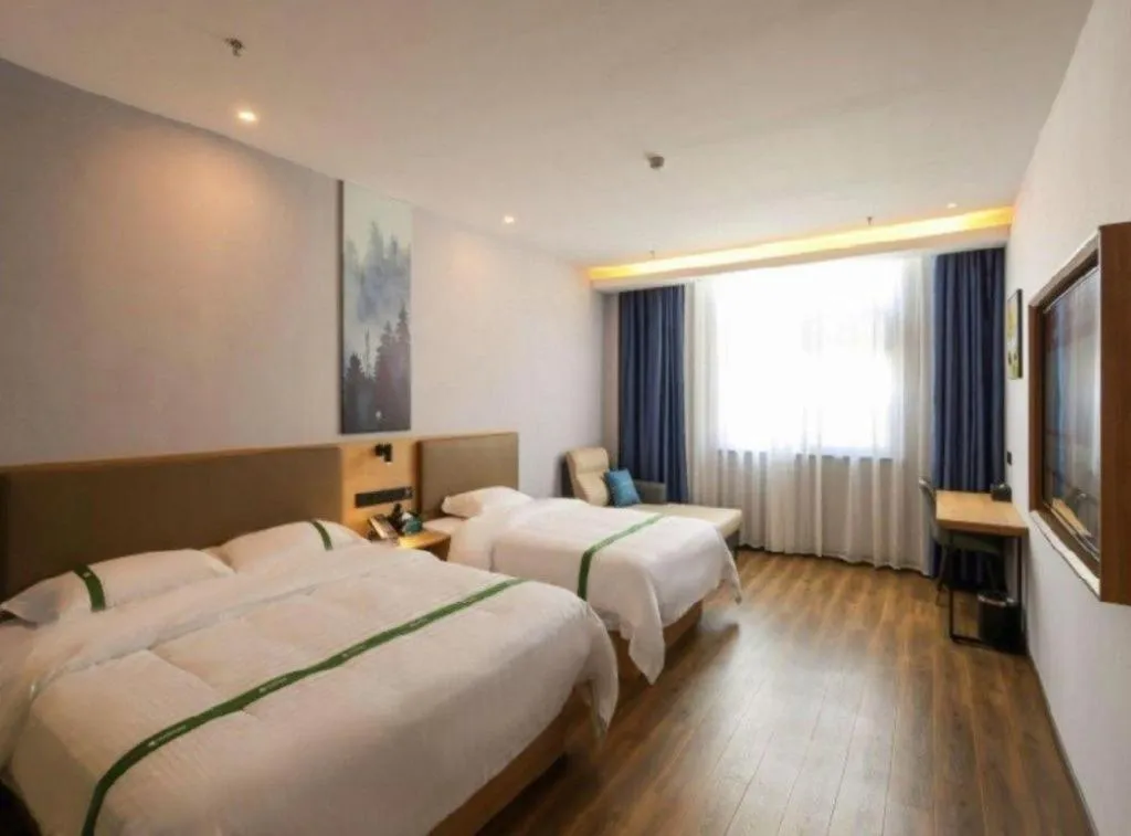 Bed in Green Tree Inn Guangxi Wuzhou 2nd Xinxing Road Liangguang Market