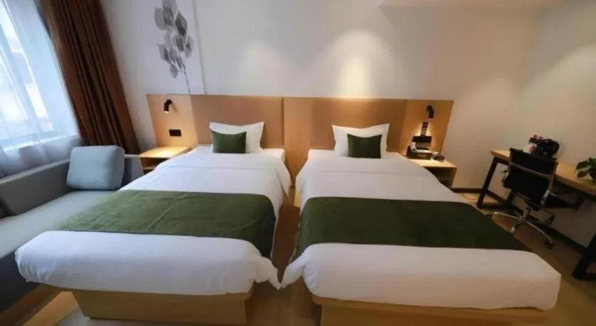 Bed in Green Tree Inn Guangxi Wuzhou 2nd Xinxing Road Liangguang Market